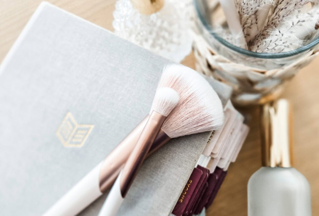 Bible and makeup brushes